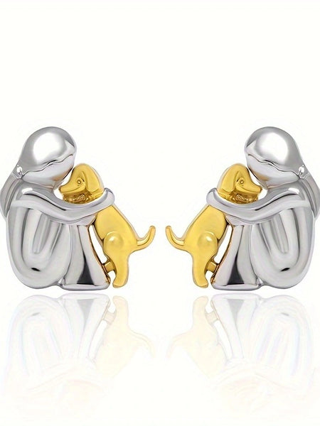 A little girl and a dog embrace earrings