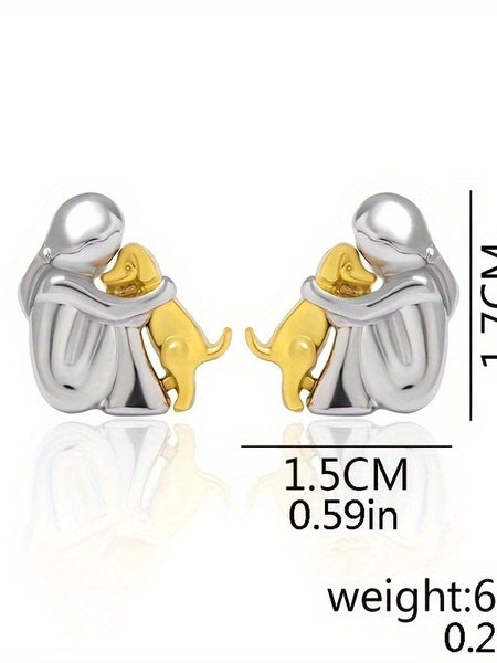 A little girl and a dog embrace earrings